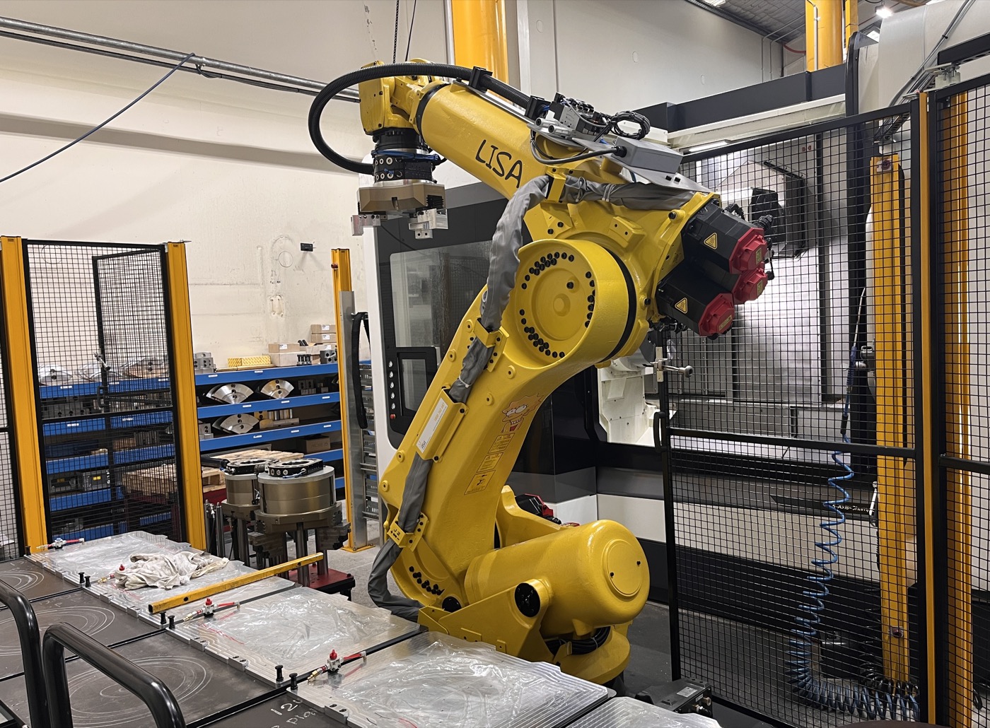 Robotic arm in metal manufacturing facility